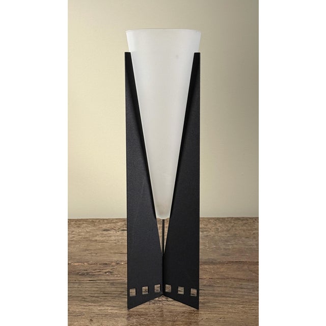 This postmodern vase features a black painted metal stand with a tapered V-shaped design that holds a removable frosted...