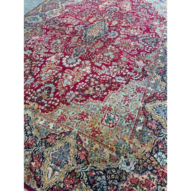Discover the timeless elegance of this exquisite antique rug featuring a floral design reminiscent of French Savonnerie...