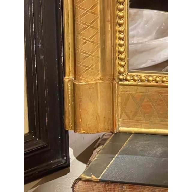 The French Louis Philippe Mirror with X Pattern Frame with a beaded inner border is a stylish and elegant addition to any...