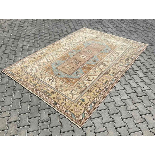 This gorgeous traditional hand knotted Vintage Anatolian area rug is approximately 70 years old in excellent vintage...