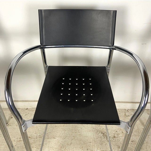 Chrome and black plastic barstools with foot rest. Seats have black perforation. We have (11) of these total if you'd like...