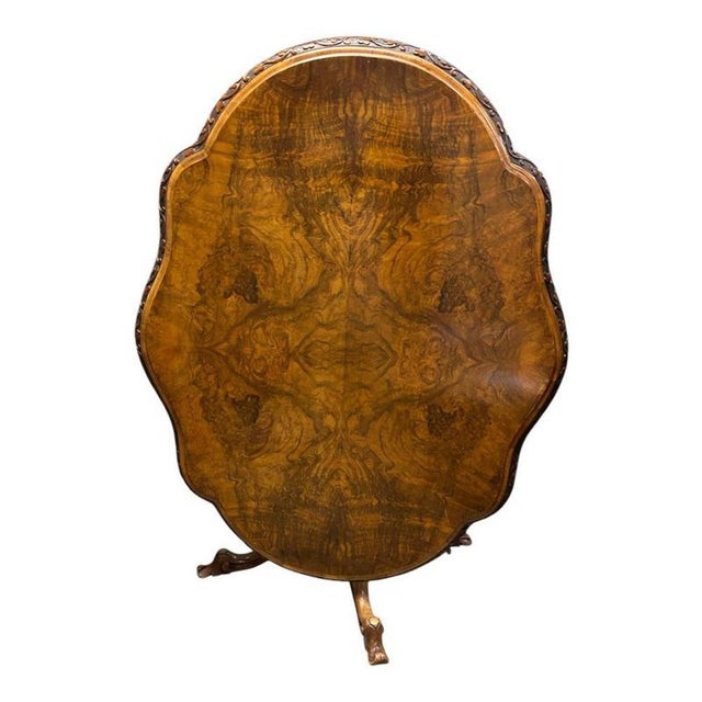 A stunning Irish walnut centre table dating to the Victorian period, crafted from richly figured burr walnut Circa 1860...