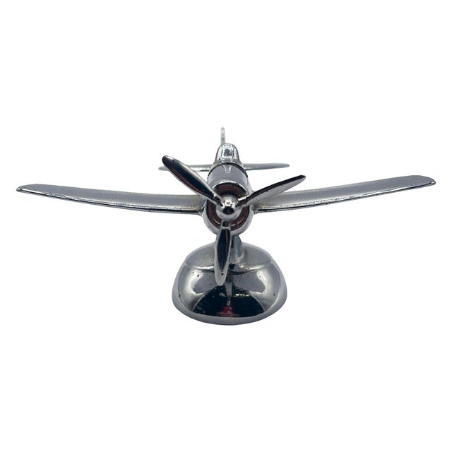 Art Deco style chrome propeller airplane table butane lighter by Hamilton, when the propeller is turned the black lighter...