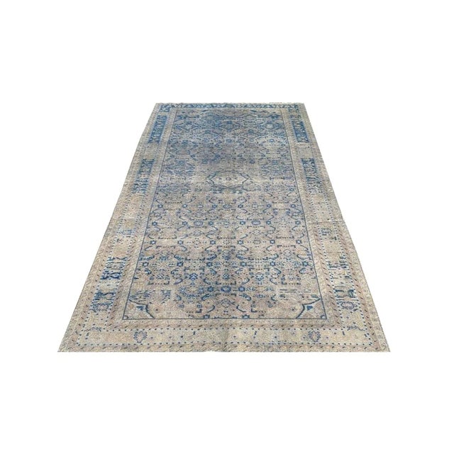 Exact Size: 5'5" x 10'4" Color: Blue Age: Old Materials: Wool Construction: Hand Knotted