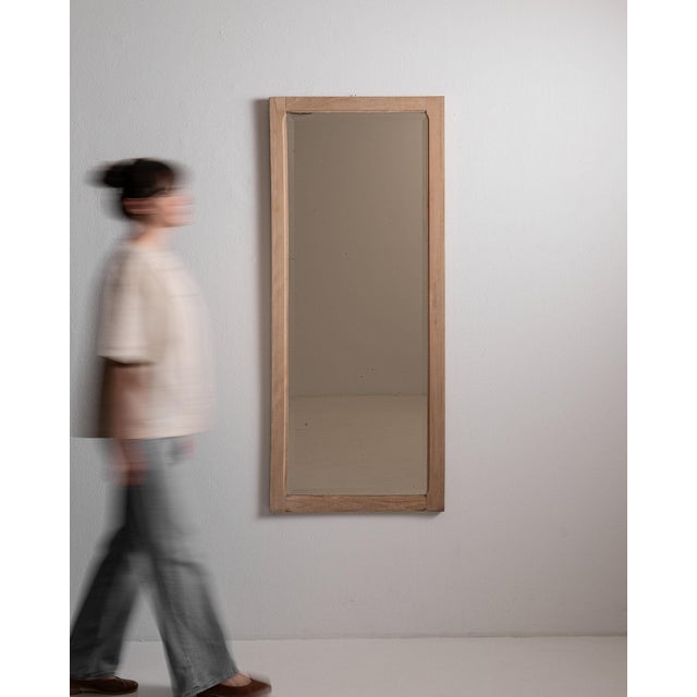 This piece presents as a mirror, distinguished by natural bleached oak frame, tall rectangular. Originating in France...