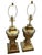 A beautiful pair of brass urn style lamps. Each lamp measures 7 3/8” wide x 7 3/8” deep Height including finial 31 1/2”...