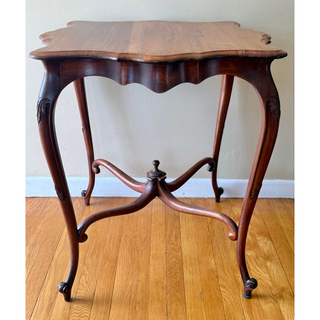 Antique French Provincial Louis XV game table with carved cabriole legs on scroll feet and a scalloped apron. Perfect for...