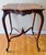 Antique French Provincial Louis XV game table with carved cabriole legs on scroll feet and a scalloped apron. Perfect for...