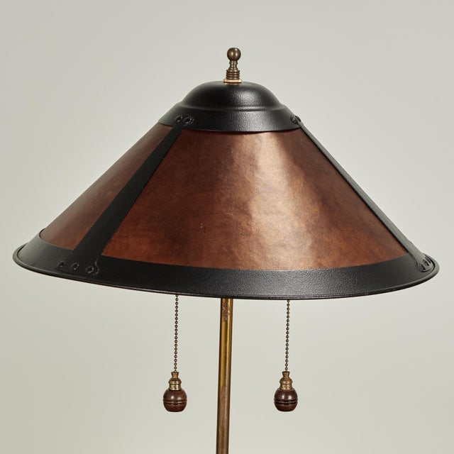 Standout pair of antique English leather fire buckets now table lamps each with an armorial crest. The later translucent...