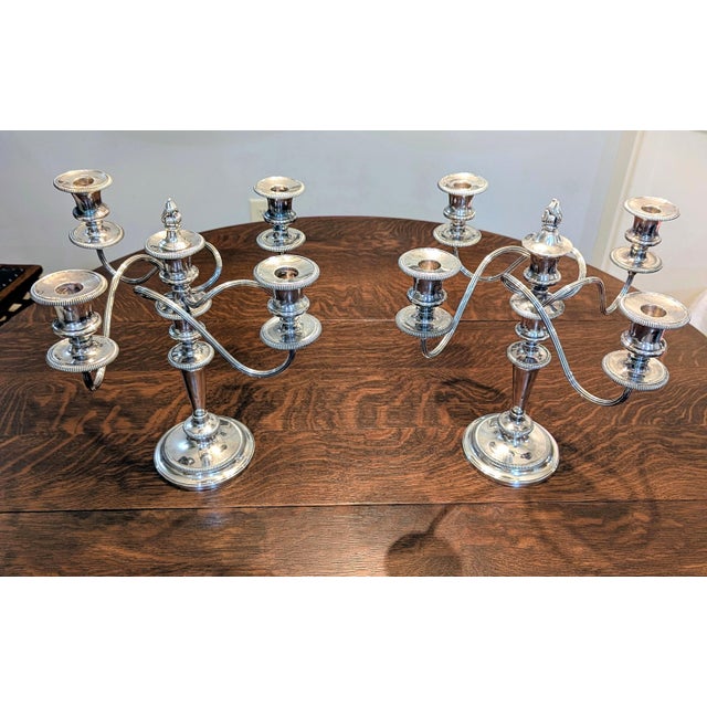 This exquisite pair of antique candelabras, made by renown Barker Ellis of England, consist of heavy silver electroplate...