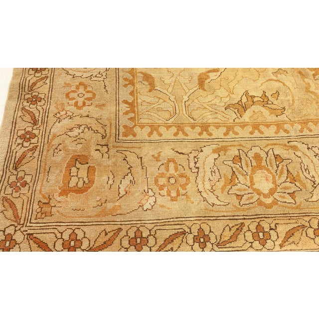 An elegant late 19th century Amritsar antique carpet, the camel field with a luxurious overall design of sand and light...