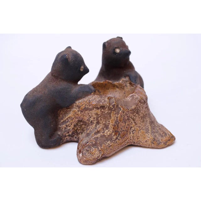 Charming chalkware duo of black bear cubs on a tree trunk. Bears' eyes are cut and applied glass. Extraordinary...