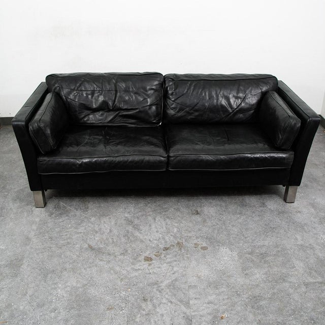 High quality early black leather Danish modern 2 seater sofa / couch by unknown maker .This piece was imported directly...