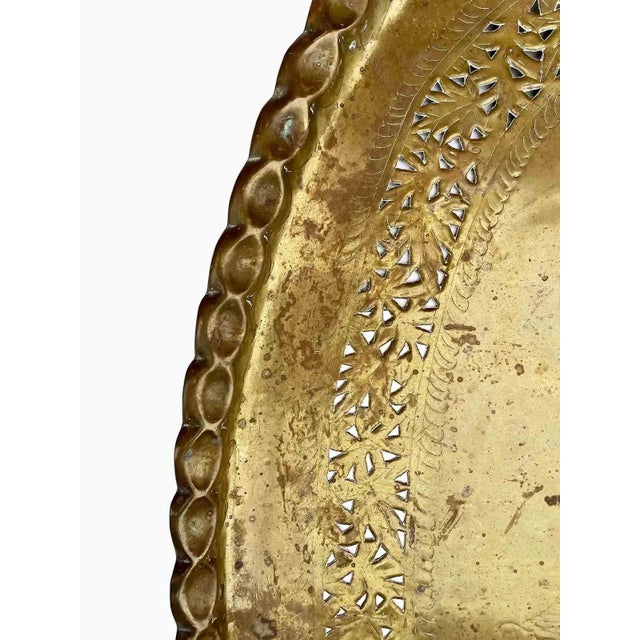 Vintage large oval brass decorative tray with perforated design at the center and towards the border.