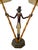 Hollywood Regency style table lamp featuring a monkey dressed as a bellhop and holding two bamboo "torches". Cast iron and...