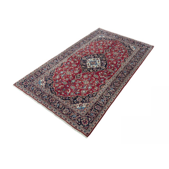 A masterpiece of fine handcraft: This exquisite, hand-knotted rug made of fine natural silk combines timeless elegance...