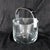 This is a rounded square thick crystal ice bucket by Orrefors. I do not know the pattern name. The ice bucket is clear...