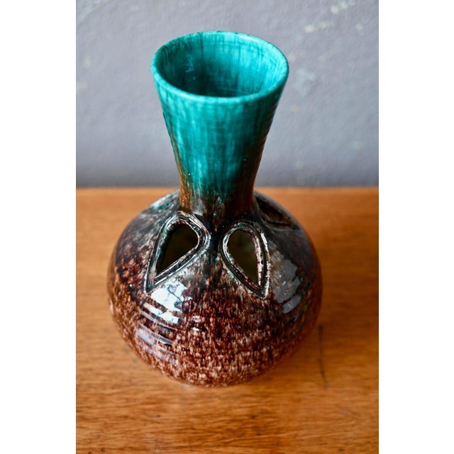 A vase that perfectly encapsulates the poetry of French art ceramics from the 1950s and 60s. Signed Accolay, this Burgundy...