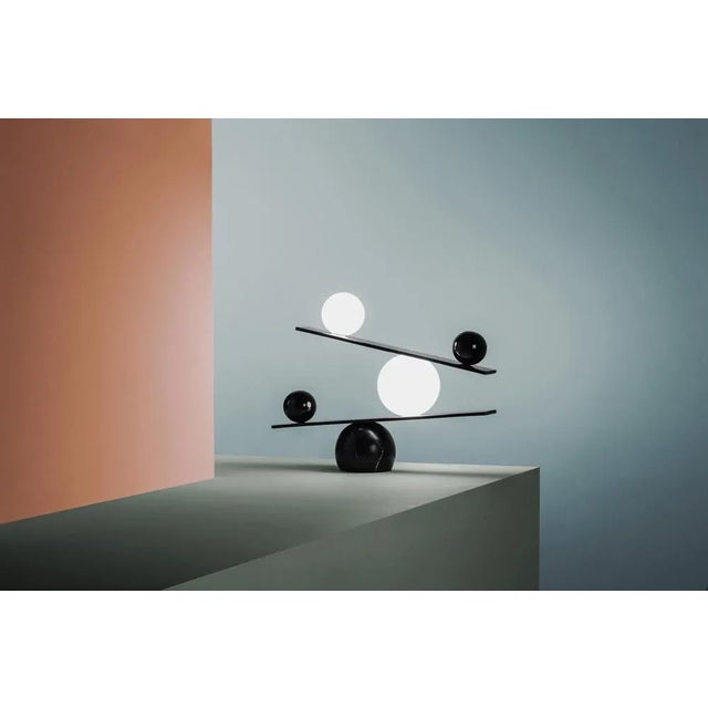 Balance table lamp by victor castanera. Balance is a playful and curiosity evoking tribute to the concepts of gravity and...