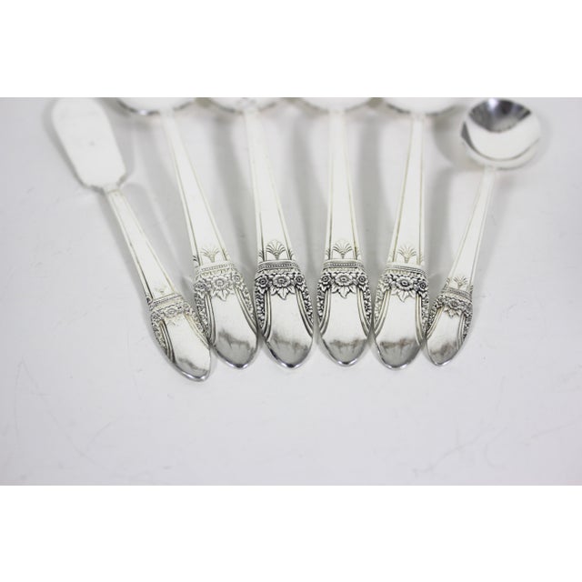 Six piece hostess set of serving utensils in the First Love pattern from 1937. This is silverplate. In excellent used...