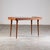 A stunning coffee table styled after Paolo Buffa for Permanente Mobili Cantù, showcasing the refined craftsmanship and...