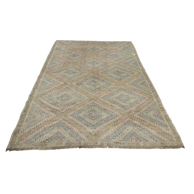 Embroidered vintage washed out kilim rug from Denizli region of Turkey. Approximately 50-60 years old. In very good condition