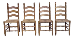 A Set of Four Rustic Vintage Oak and Rush Seat Dining Chairs With Ladder Backs