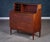 Functional Danish teak secretary / writing desk from the 1960s featuring three spacious drawers and a pull-out writing...