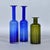 Trio of Gulvvase glass vases designed by Otto Brauer for Holmegaard. This set includes a pair of 17 inch tall blue vases...
