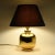 Gold-plated ceramic table lamp by Ugo Zaccagnini. Made in Italy in 1960s Dimensions without the lampshade: h. 23 cm, dia....