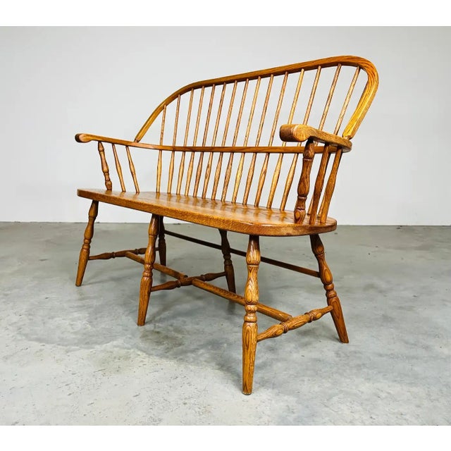 Vintage Windsor spindle back bench with full stretcher constructed of solid Oak. Generous proportions, in solid clean...