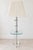 Striking vintage floor lamp featuring a clear lucite/acrylic body with polished chrome accents and an integrated glass...