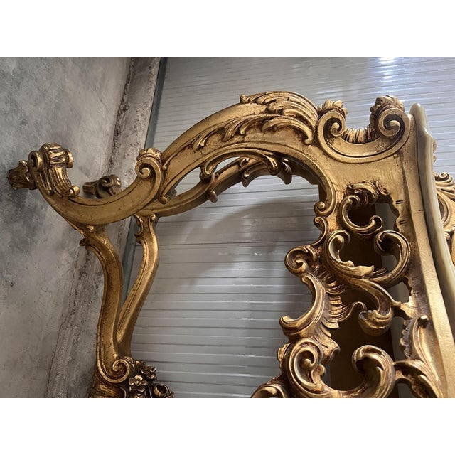 20th-century Italian Baroque console table with mirror with beige marble top Fully carved and in good condition Well-...
