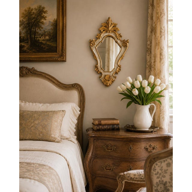 A lovely petite vintage Italian Florentine Rococo style giltwood wall mirror, circa 1950. This stunning mirror displays...