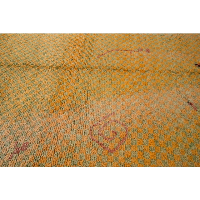 Beautiful Vintage Moroccan Wool rug with an orange field and multi-color accents in all-over geometric design. This rug...