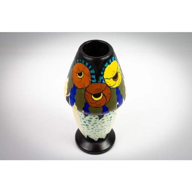 Glazed ceramic, decorated using a high-fire technique with flat areas outlined in black, following a principle similar to...
