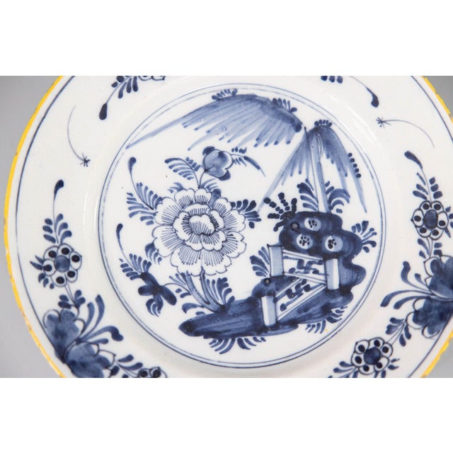A beautiful antique 18th-Century Dutch Delft faience chinoiserie flower garden plate. This lovely plate has hand painted...