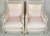 A pair of French bergeres in the style of Louis XVI and dating from the early 20th century. The chairs are stylish...