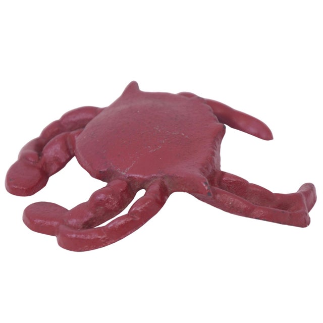 Vintage four inch cast iron crab in deep red makes a coastal nautical accent. Marked "481". Light wear.
