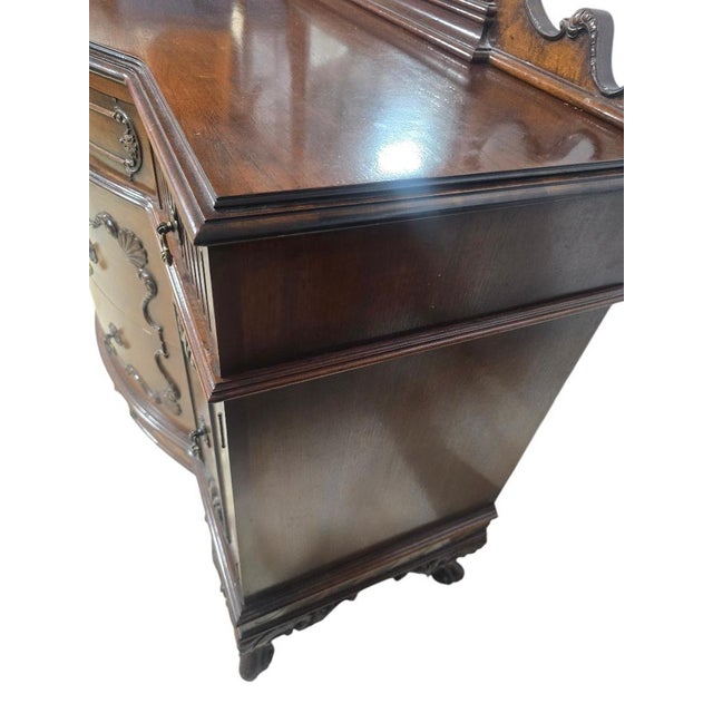 Elegant vintage French Provincial style vanity dresser featuring a dramatic serpentine front, carved cabriole legs, ornate...