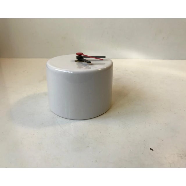 Rare porcelain wall clock by the Swedish company Ifö. Scandinavian Minimalism in style. Its wellkept and in working order....