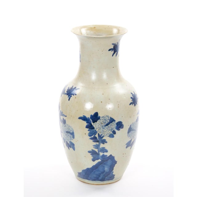 A beautifully crafted mid-20th-century Chinese porcelain vase, finely decorated in underglaze cobalt blue with elegant...