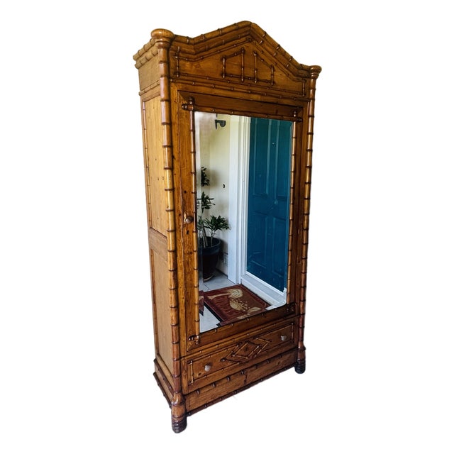 Gorgeous antique wardrobe, armoire or cabinet. It has a very stately presence! This beautiful antique is most likely...