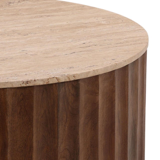 Round travertine top coffee table with scalloped wood base. Beautiful warm tan and brown tones. Travertine differences to...