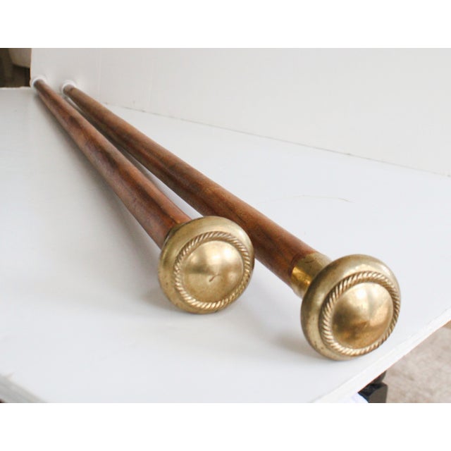 A rather fantastic pair of vintage English walking stick's. Decorative Polished solid brass handle's with handwood shaft....