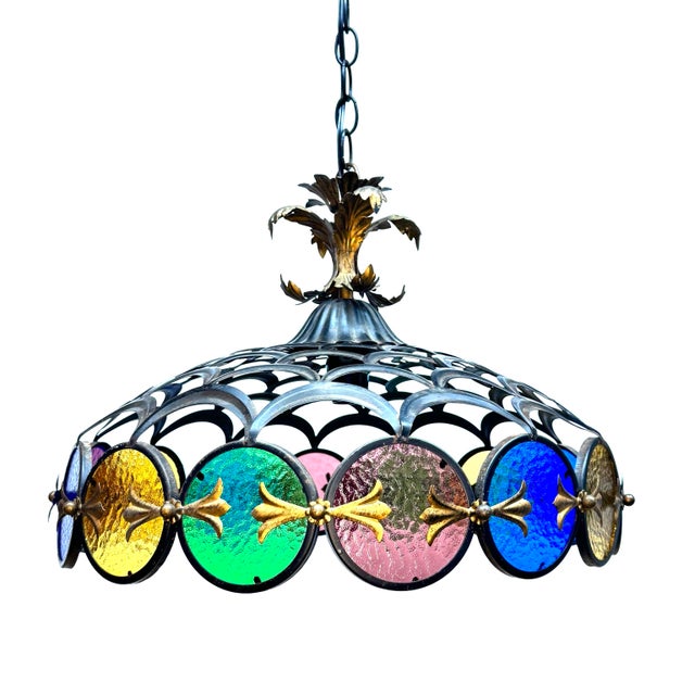 Unique colored glass rounds suspended by iron moon shaped cutouts with decorative brass accents. 18” Diameter 40” Max...