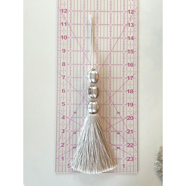 Bring this charming, handmade ivory and taupe satin beaded key tassel to your interiors for a touch of coastal chic...