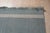 A handwoven wool flatweave, made in India and measuring 8' x 10'. Flatweaves carry no pile, so the geometry is woven...