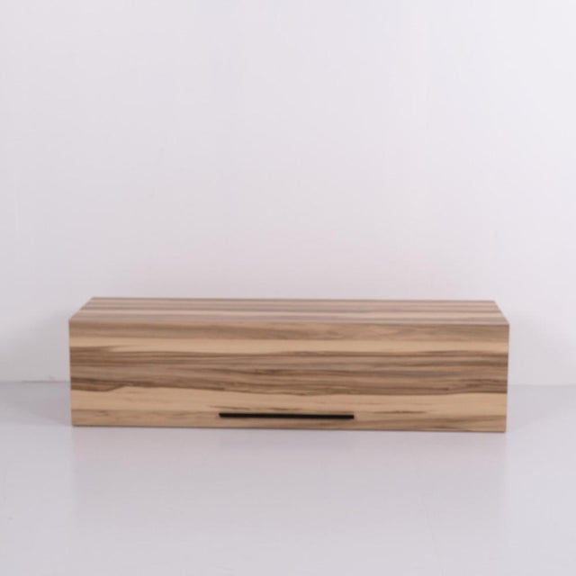 Wall-mounted cabinet crafted in solid acacia wood with two separate storage compartments. The cabinet features a simple...