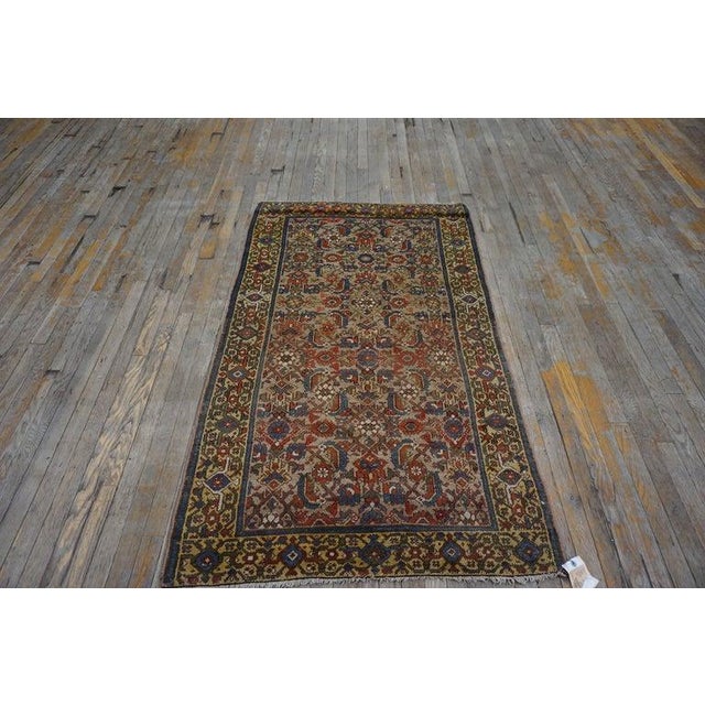 Antique Malayer Small Scatter Size Brown Rug, Circa Date: 1920s. This exquisite example of Persian weaving showcases the...